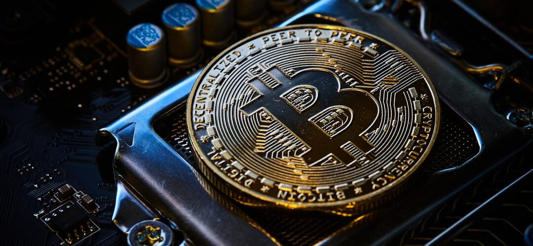 a bitcoin on top of a computer motherboard