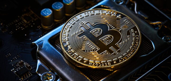 a bitcoin on top of a computer motherboard