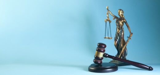 Lady justice and gavel on a blue background