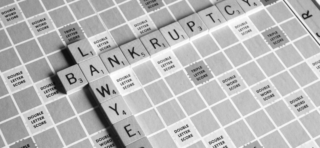 gray scale photography of Lawyer Bankruptcy scrabbles tiles