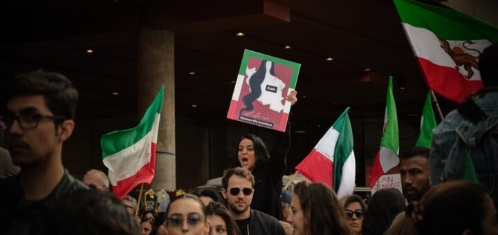 a group of people holding flags