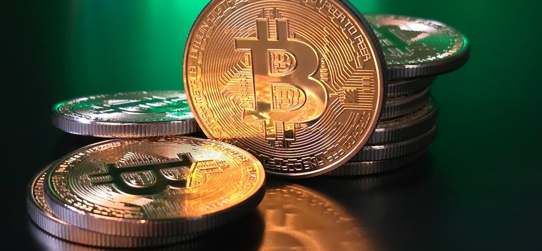 a pile of bitcoins sitting on top of a table
