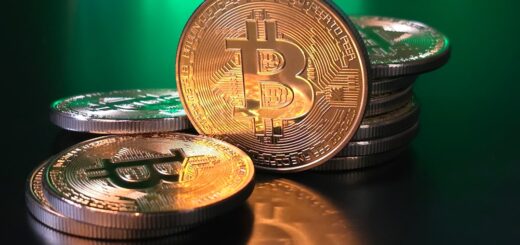 a pile of bitcoins sitting on top of a table