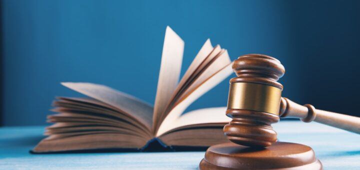 judges gavel and open book on table