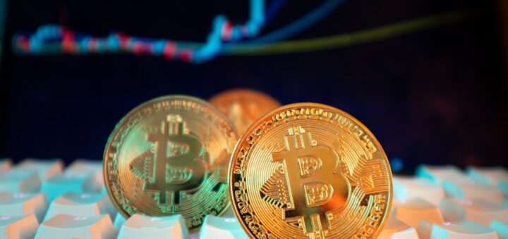 Bitcoin coins are displayed with a stock chart.