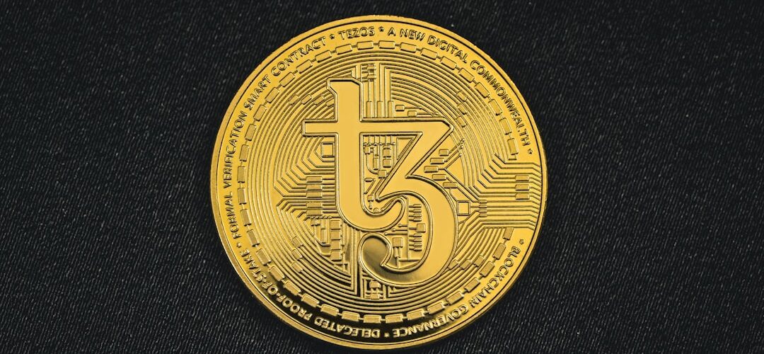 a gold coin with the number five printed on it