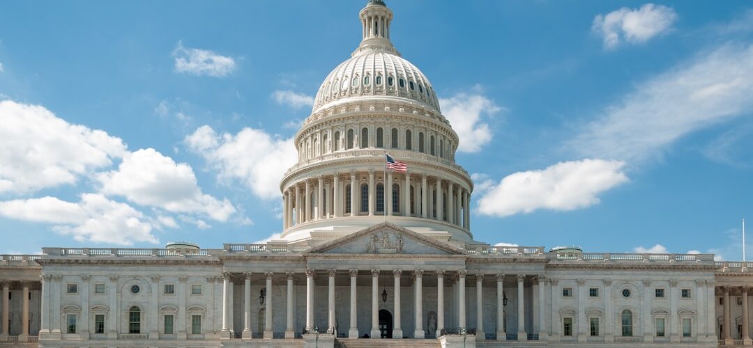 a large white building with a flag on top of it