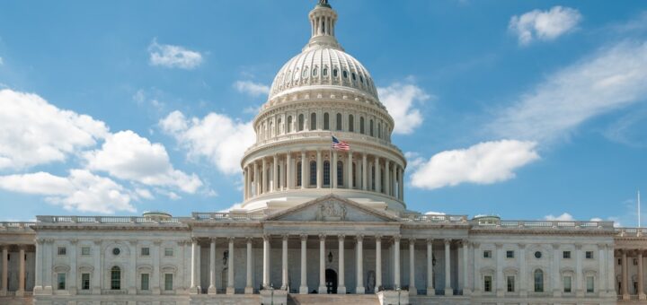 a large white building with a flag on top of it