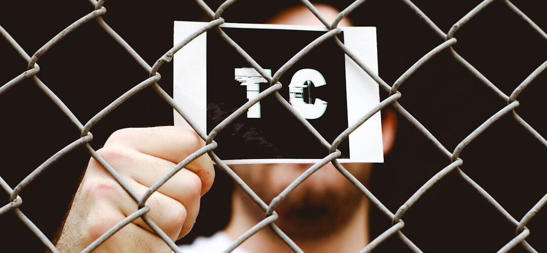 person holding black and white p print box